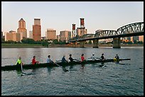 Eight-oar shell on Williamette River and city skyline. Portland, Oregon, USA