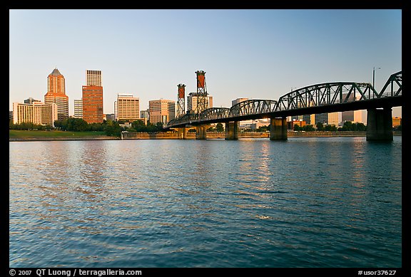 Portland skyline, Hawthorne Bridge, and Williamette River at sunrise. Portland, Oregon, USA (color)