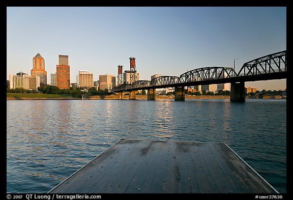 Deck, and Portland skyline with bridge at sunrise. Portland, Oregon, USA