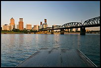 Deck, and Portland skyline with bridge at sunrise. Portland, Oregon, USA (color)