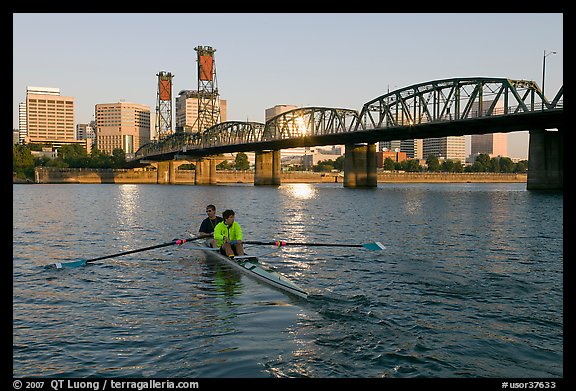 Men on double-oar shell rowing on Williamette River. Portland, Oregon, USA (color)