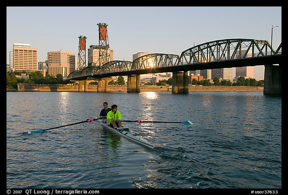 Men on double-oar shell rowing on Williamette River. Portland, Oregon, USA