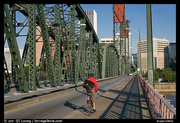 Bicyclist on Hawthorne Bridge. Portland, Oregon, USA