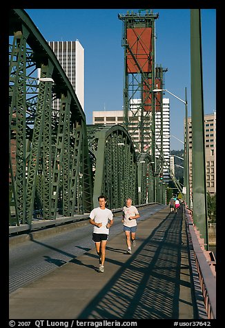 Men jogging on Hawthorne Bridge. Portland, Oregon, USA (color)