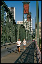 Men jogging on Hawthorne Bridge. Portland, Oregon, USA (color)