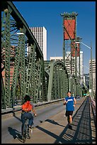 Jogger and cyclist on Hawthorne Bridge. Portland, Oregon, USA (color)