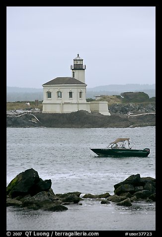 Small boat and Coquille River lighthouse. Bandon, Oregon, USA (color)