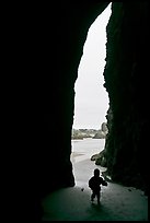 Infant and sea cave opening from inside. Bandon, Oregon, USA