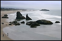 Beach at Face Rock with two people walking. Bandon, Oregon, USA ( color)