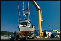 Fishing boat lifted onto deck, Port Orford. Oregon, USA (color)