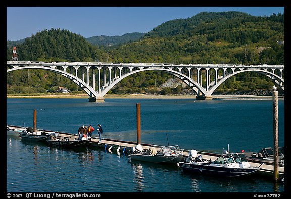 Small boat deck and Rogue River bridge. Oregon, USA (color)