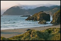 Solitary figure on beach, Pistol River State Park. Oregon, USA