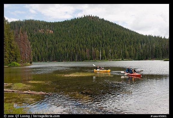 Family kayaking on Devils Lake. Oregon, USA (color)