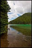 Devils Lake and forested hill. Oregon, USA