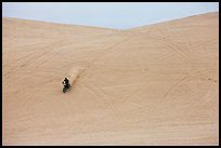 Motorcyle down dune, Oregon Dunes National Recreation Area. Oregon, USA