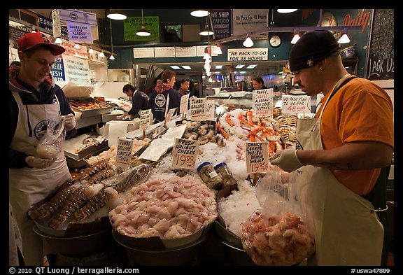 Countermen unloading seafood,  Pike Place Market. Seattle, Washington (color)