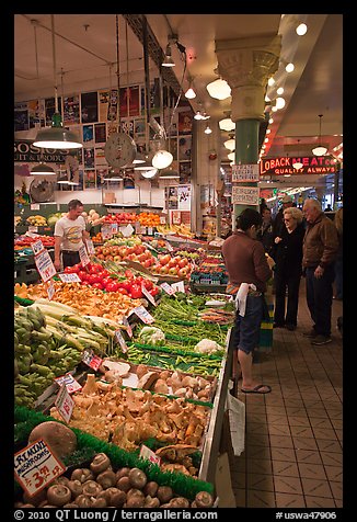 Fruit and vegetable market in Main Arcade, Pike Place Market. Seattle, Washington