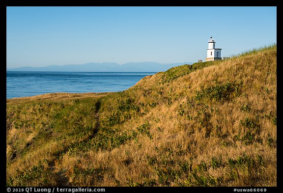 Grassy hill with lighthouse, Cattle Point Natural Resources Conservation Area, San Juan Islands National Monument. Washington (color)