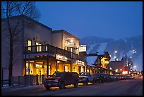 Storehouses and night-lit Snow King ski area. Jackson, Wyoming, USA