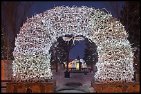 Arch of shed elk antlers at night. Jackson, Wyoming, USA
