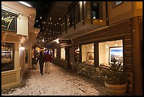 Alley with art galleries, winter night. Jackson, Wyoming, USA