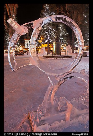 Town square statue framed by ice sculpture. Jackson, Wyoming, USA