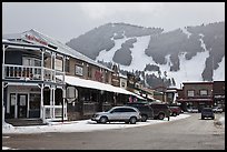 Town square stores and ski slopes in winter. Jackson, Wyoming, USA (color)