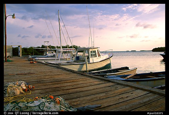 Pier and small boats at sunset, La Parguera. Puerto Rico