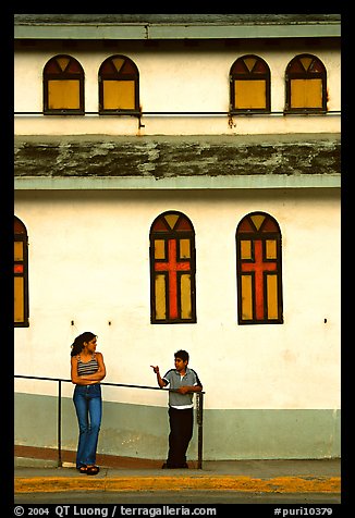 Woman and boy talking besides a church, La Parguera. Puerto Rico