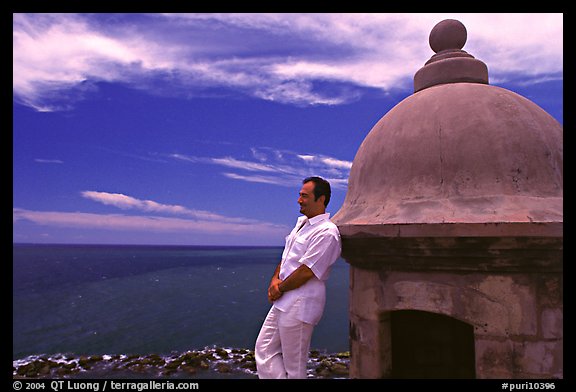 Man leaning against a lookout turret, Fort San Felipe del Morro. San Juan, Puerto Rico (color)