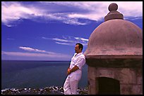 Man leaning against a lookout turret, Fort San Felipe del Morro. San Juan, Puerto Rico ( color)