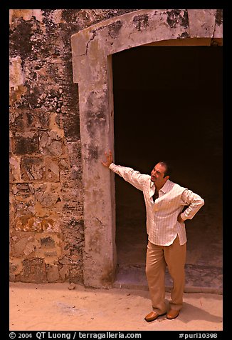 Man standing next to a doorway, El Morro Fortress. San Juan, Puerto Rico