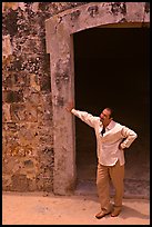 Man standing next to a doorway, El Morro Fortress. San Juan, Puerto Rico