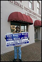 African-American man holding a voting sign in front of the voting rights museum. Selma, Alabama, USA ( color)