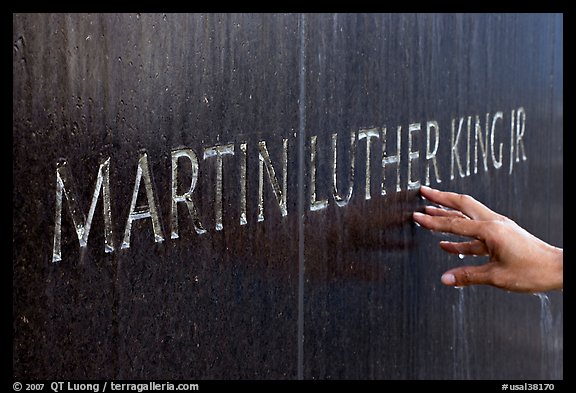 Hand touching the letters Martin Luther King on the Civil Rights Memorial wall. Montgomery, Alabama, USA
