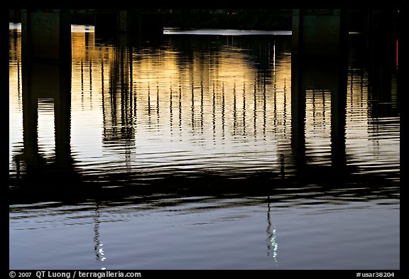 Bridges reflected in the Arkansas River at sunrise. Little Rock, Arkansas, USA