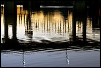 Bridges reflected in the Arkansas River at sunrise. Little Rock, Arkansas, USA