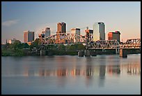 Skyline and bridge with reflections in river at sunrise. Little Rock, Arkansas, USA