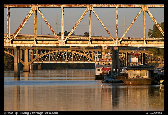 Bridges over Arkansas River, submarine and riverboats at sunrise. Little Rock, Arkansas, USA