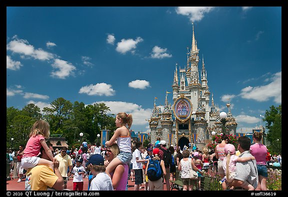 Girls on fathers shoulders, Cinderella Castle. Orlando, Florida, USA (color)