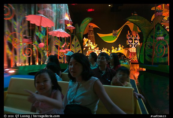 Families in indoor boat ride, Magic Kingdom. Orlando, Florida, USA