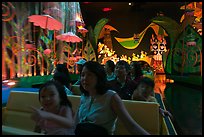 Families in indoor boat ride, Magic Kingdom. Orlando, Florida, USA (color)