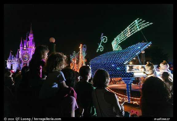 Families watching night parade, Magic Kingdom. Orlando, Florida, USA (color)