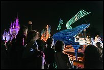 Families watching night parade, Magic Kingdom. Orlando, Florida, USA (color)