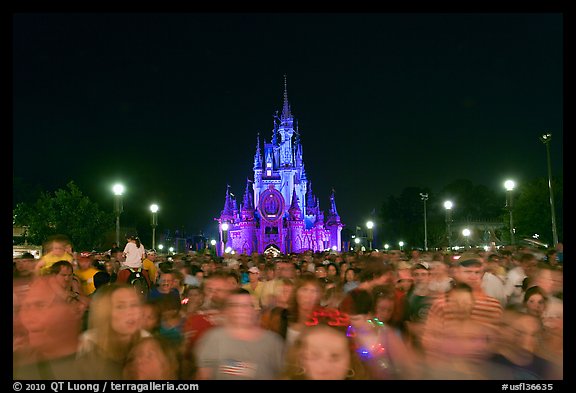 Crowds on Main Street with castle in the back at night. Orlando, Florida, USA