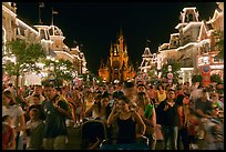 Main Street at night with crowds and castle. Orlando, Florida, USA ( color)