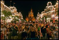 Main Street at night with crowds and castle. Orlando, Florida, USA