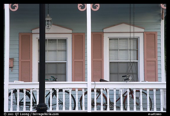 Bicycle on pastel-colored porch. Key West, Florida, USA (color)