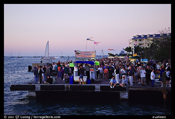 Crowds watching sunset at Mallory Square. Key West, Florida, USA (color)