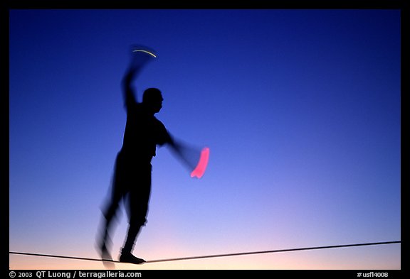 Equilibrist on Mallory Square, sunset. Key West, Florida, USA (color)